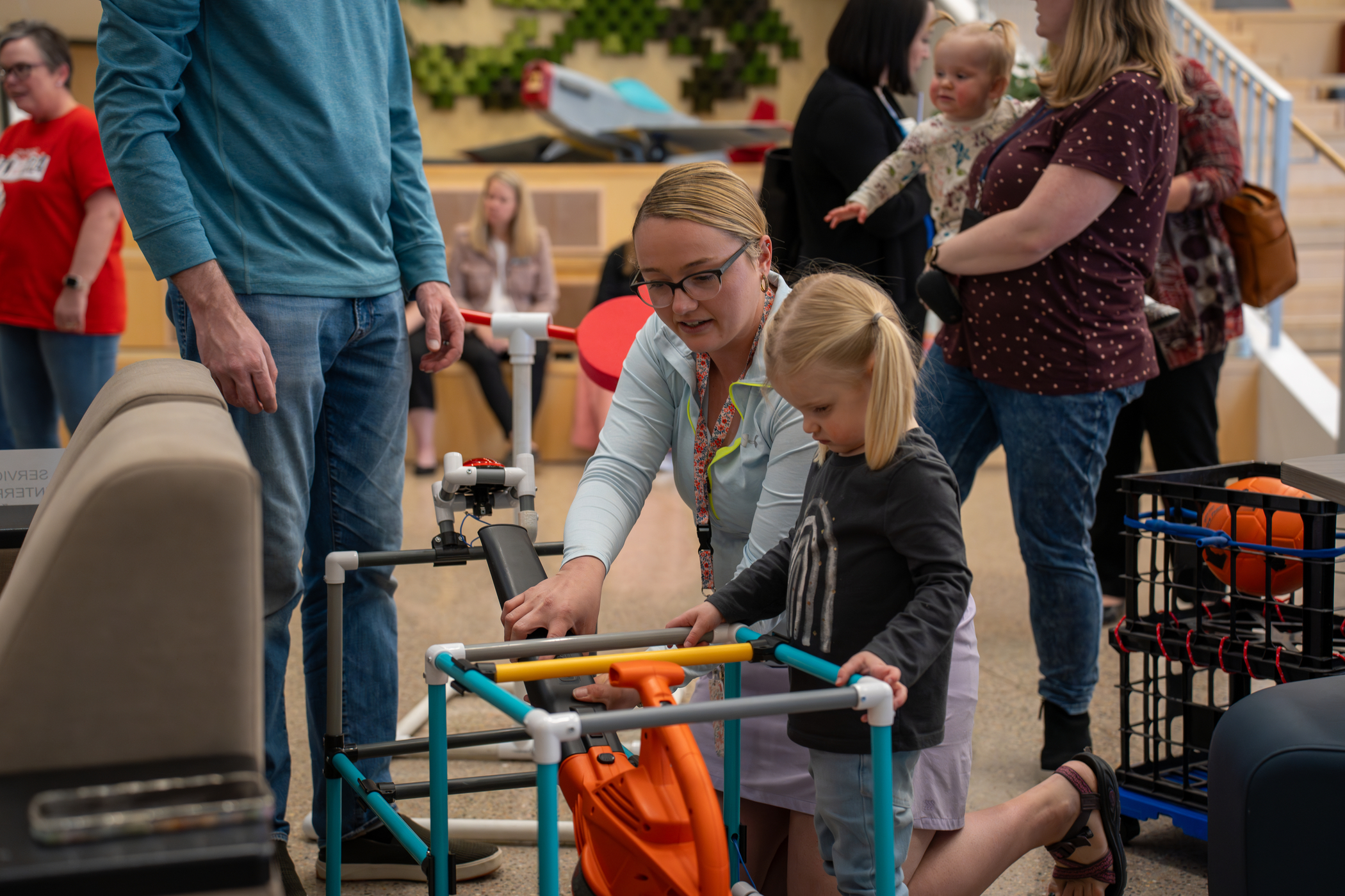 A student learns about adaptive P.E. equipment at the first annual Accessibility Night